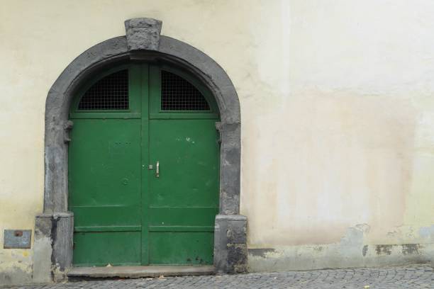istock old green iron door. 1060869464