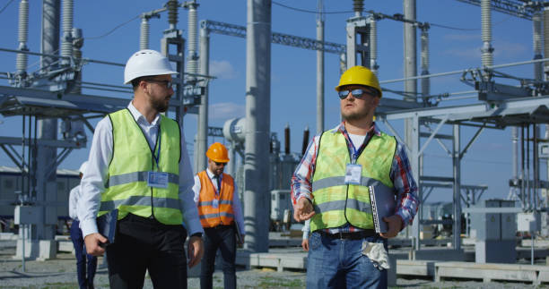 istock Group of engineers walking on solar station platform 1060876720