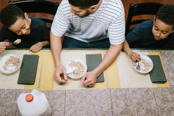 istock Father Eating Breakfast With Her Two Boys 1060877868