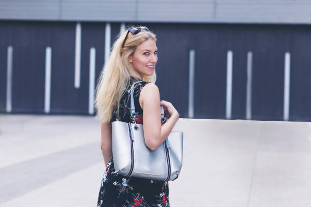 istock Cheerful woman with a purse 1060879466