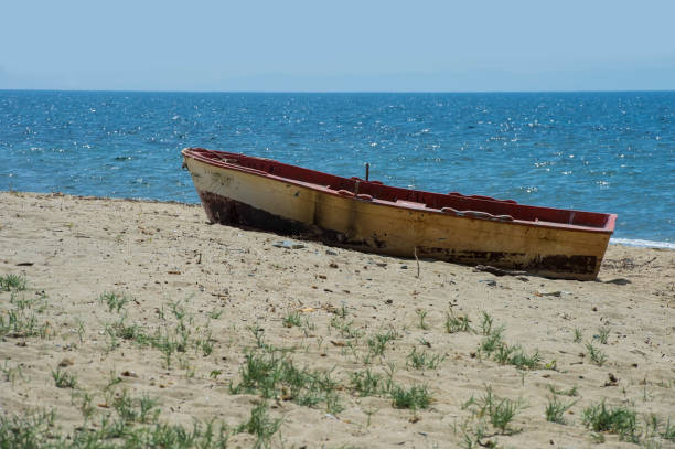 istock old wooden boat on the beach 1060880406