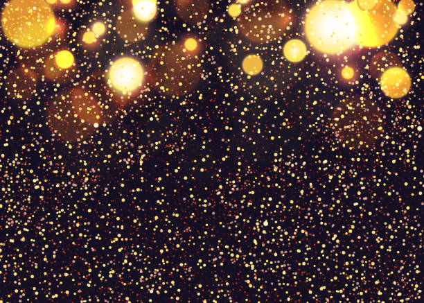 istock Abstract christmas background. Flying snow on the background of glowing light bulbs. 1060883426