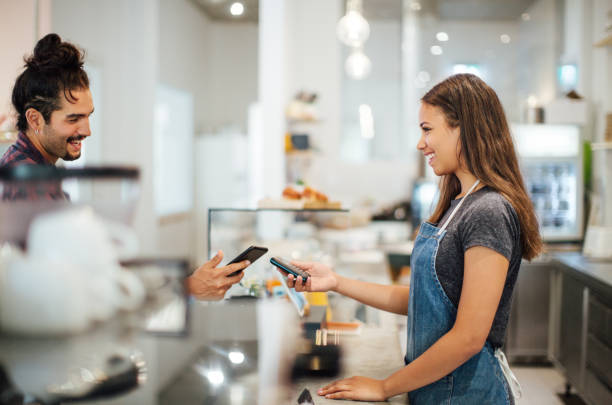 istock Customer doing contactless payment with phone in cafe 1060886666