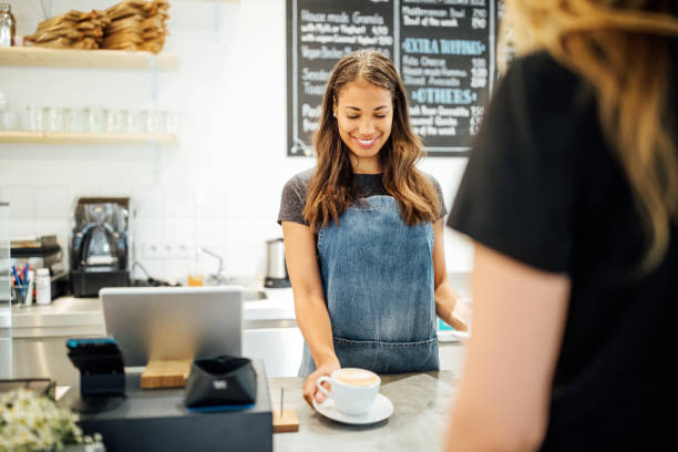 istock Female barista serving coffee to customer 1060886954