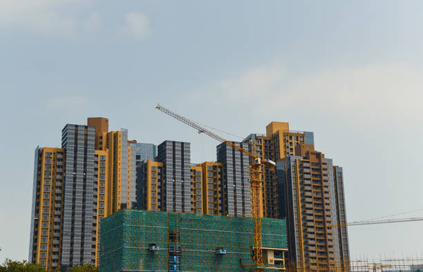 istock Cranes on the construction site of a residential block project 1060890506