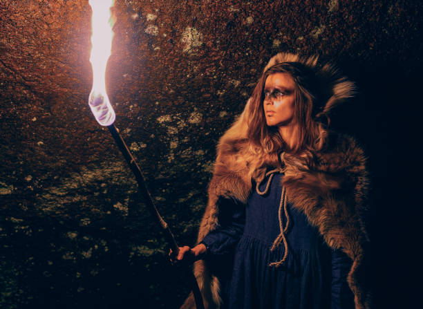 istock Girl with a torch shamanic night 1060891204