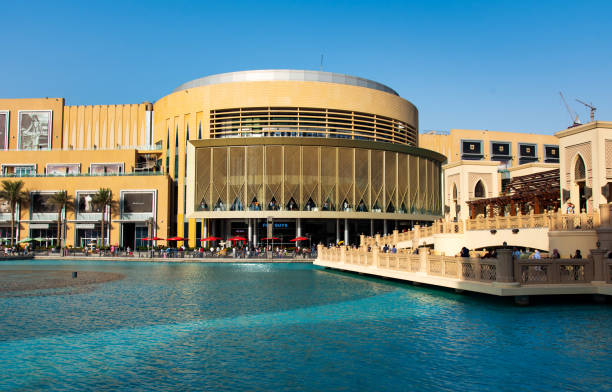Dubai, United Arab Emirates - September 26, 2018: Dubai mall modern architecture reflected in the fountain at day time