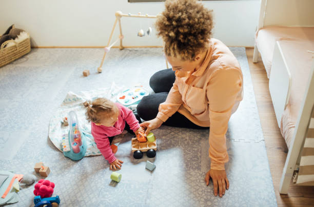 istock Mother and daughter playing with toys 1060893448