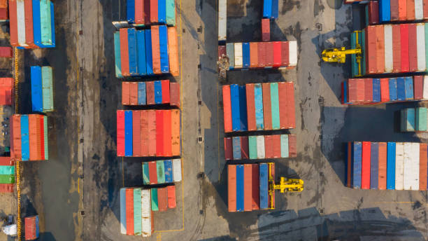 istock Container ship in export and import business and logistics. Shipping cargo to harbor by crane. Water transport International. Aerial view and top view. 1060894030
