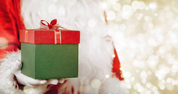 istock Santa Claus giving christmas gift 1060895890