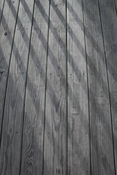 istock Old Wooden Background Texture with Light Beams 1060896744