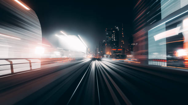 istock View from first railway carriage. Speed motion blur metro abstract background at night 1060903960