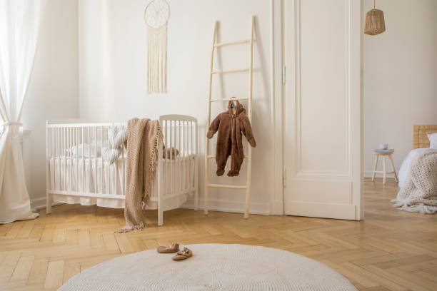 Round white carpet on the wooden floor of stylish scandinavian nursery, real photo Round white carpet on the wooden floor of stylish scandinavian nursery, real photo macrame photos stock pictures, royalty-free photos & images