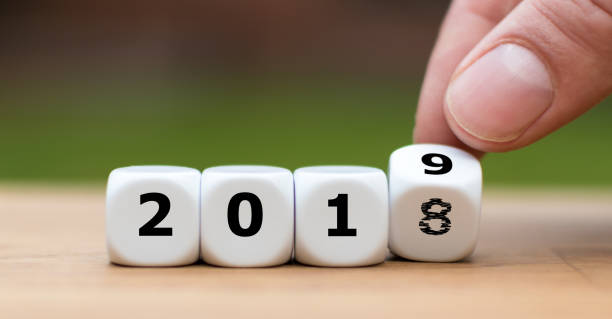 istock Hand is turning a dice and symbolically changes the year 2018 to 2019 1060908374