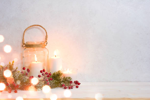 istock Christmas background, burning lantern candles decorated with frosted fir branches 1060909976