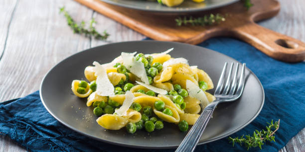 istock Italian orecchiette pasta with peas and cheese 1060912682