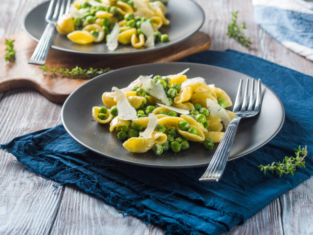 istock Italian orecchiette pasta with peas and cheese 1060912684