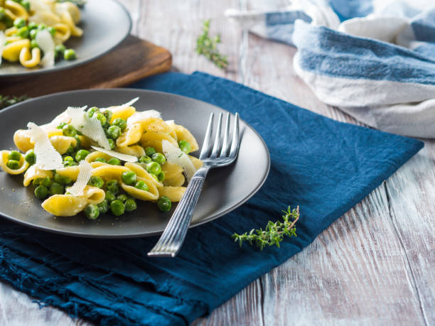 istock Italian orecchiette pasta with peas and cheese 1060912694