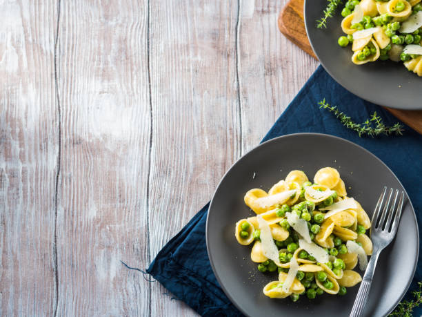 istock Italian orecchiette pasta with peas and cheese 1060912700