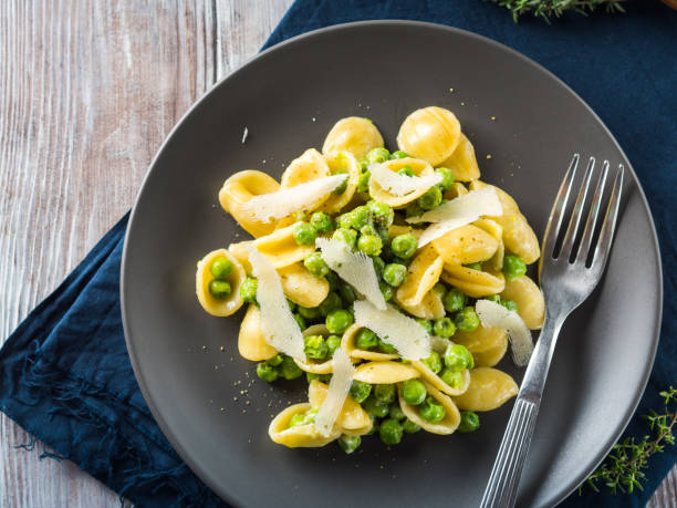 istock Italian orecchiette pasta with peas and cheese 1060912706