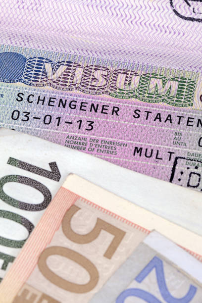istock Schengen visa with euro banknotes 1060915296