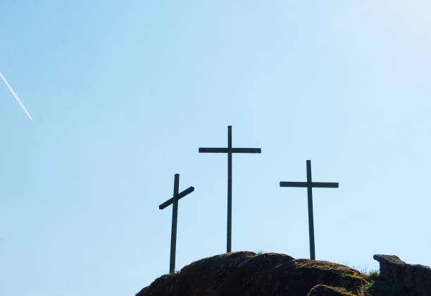 istock Three big Christian crosses outside in the blue sky 1060915466