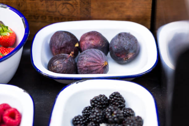 Bowls of Fresh Figs, Raspberries, Blackberries and Strawberries on Display