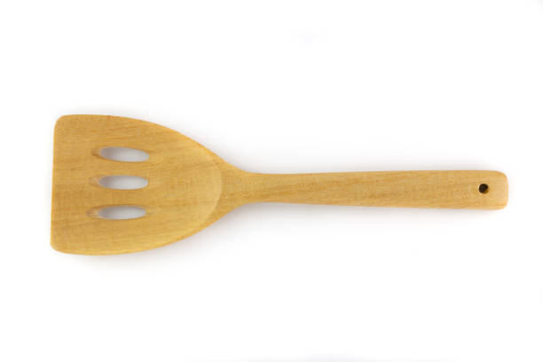 istock Wooden spatula isolated on a white background 1060917098