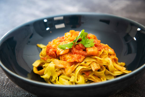 istock Pasta with Shrimp Dinner Dish on a the table 1060917318