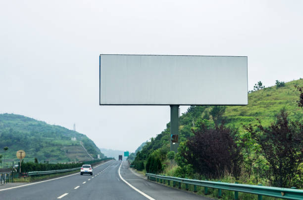 istock Blank billboard on blue sky background for new advertisement 1060918072