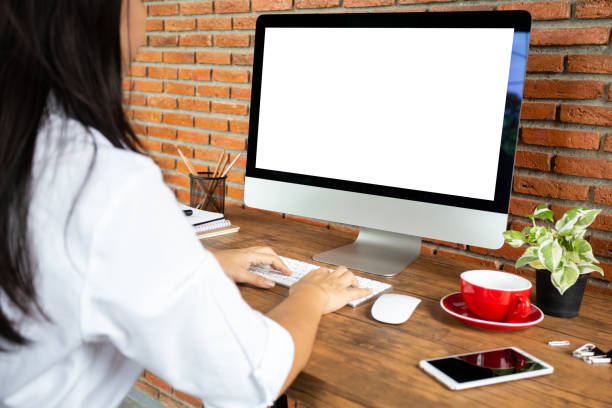 istock young woman working empty screen computer on wood desk in home office. with clipping path 1060918088