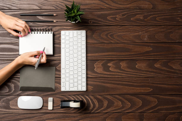 istock Woman working in modern office. Top view 1060920272