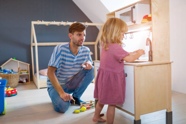 istock Father Playing with Daughter At Home 1060920750
