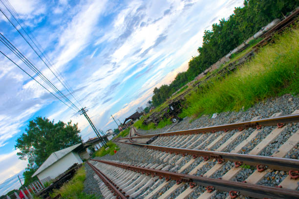 istock close up Two railway tracks merge together 1060921460