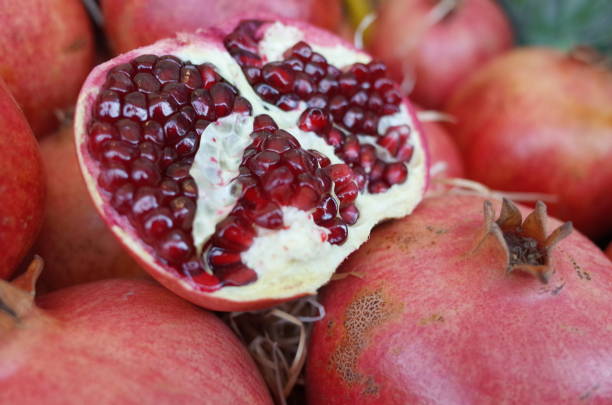 istock Halved pomegranate in market 1060927528