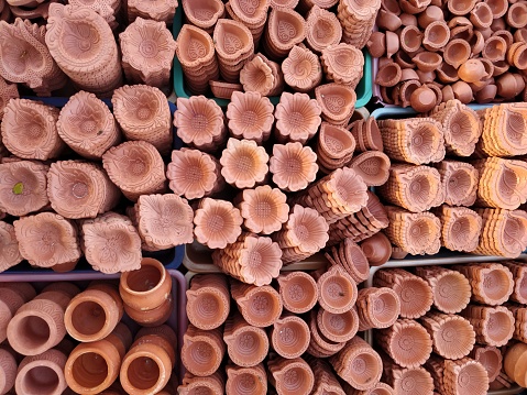 Ceramic diya for sale at market during Diwali festival