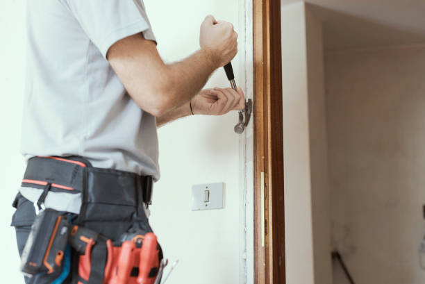 istock Carpenter removing an old door at home 1060934104