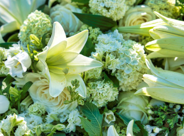 istock white flowers for funeral 1060934438