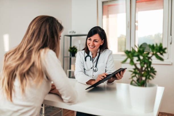 istock Female doctor explaining diagnosis to her young patient. 1060937220