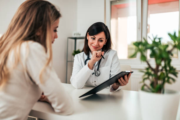 istock Smiling doctor consulting her patient. 1060937242