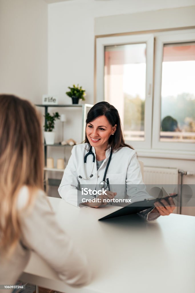 Female doctor and female patient talking about test results. Doctor Stock Photo