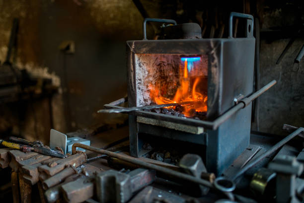 istock Furnace with metal workpiece in smithy. 1060937424