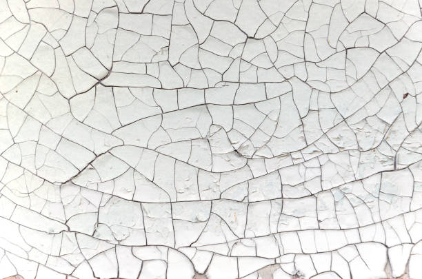 istock Background of broken cracked white paint 1060941994