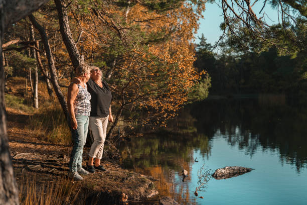 istock Two happy senior women on a walk 1060944914