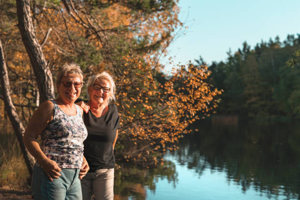 istock Two happy senior women on a walk 1060944938