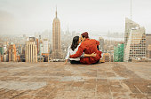 istock Rear view of couple embracing in New York 1060945240
