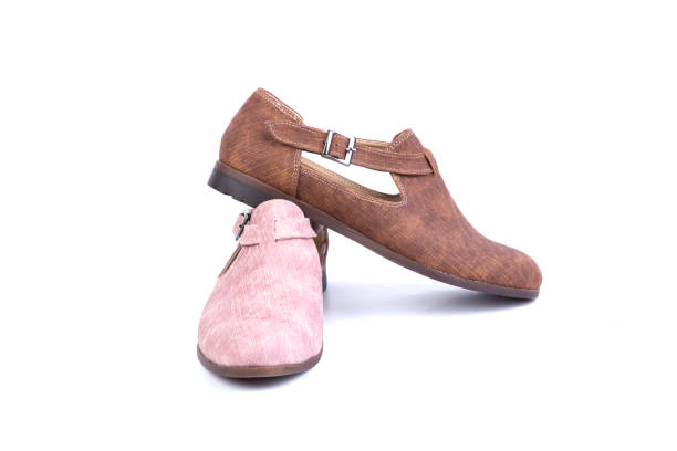 istock woman shoes at white background 1060950634