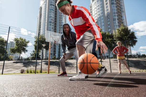 istock Sportive young people having a basketball match 1060956172