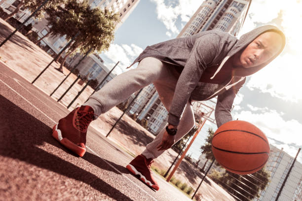 istock Low angle of a serious concentrated man 1060956312