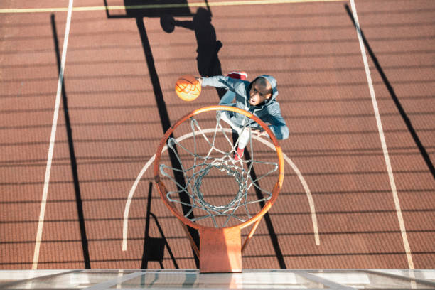 istock Top view of a nice young man playing basketball 1060957154